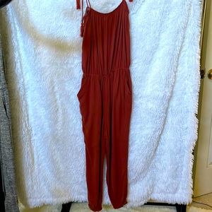 Women’s size Medium Jumper. One piece, adjustable tie straps. Color rust